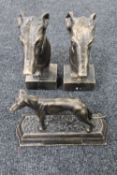 A pair of cast iron greyhound bookends and a further cast iron figure of a greyhound on plinth