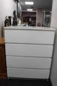An Ikea white four drawer chest
