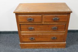 An Edwardian pine four drawer chest