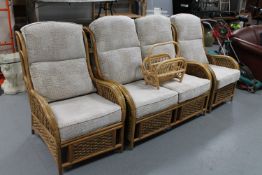 A bamboo and wicker three piece conservatory suite together with a magazine rack