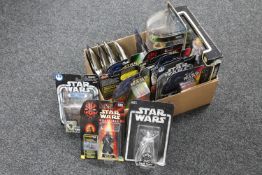 A box containing boxed Star Wars figures