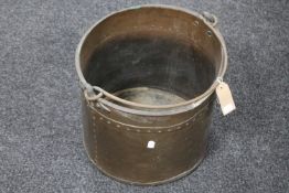 An antique swing handled copper bucket