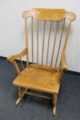 A beech spindle back rocking chair