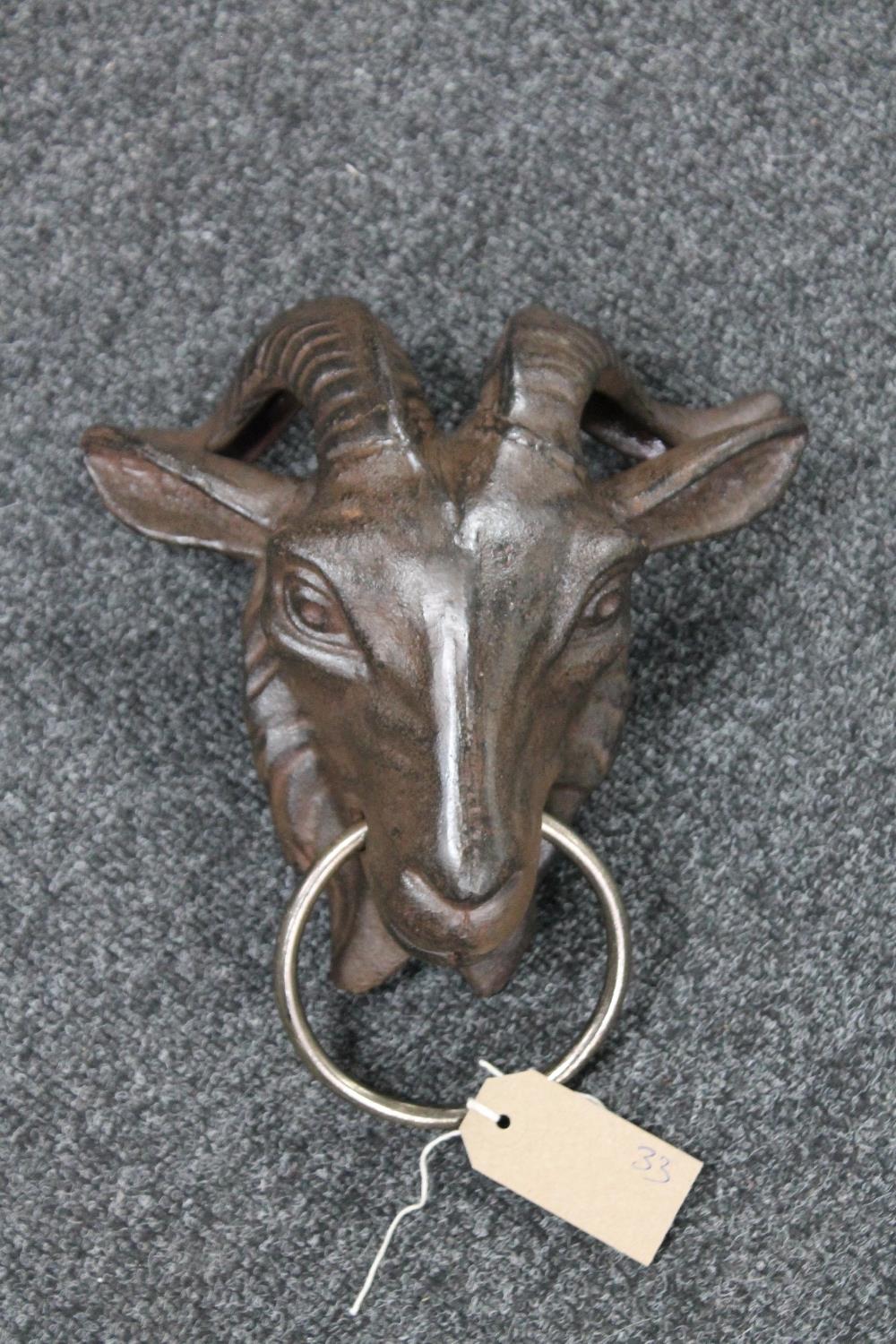 A cast iron goat's head horse hitch