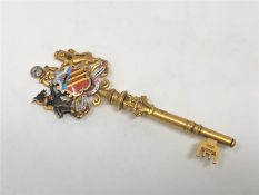 A superb quality 15ct gold and enamel presentation key, given to the right honourable Thomas Briggs,