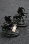 A pair of Victorian spelter figures of rearing horses on wooden plinths