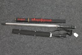 Two Japanese style tanto swords in scabbards and one other