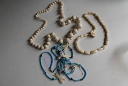 A box of two antique ivory necklaces and a beaded necklace