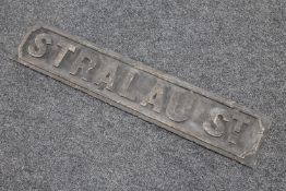 A metal street sign : Stralau Street