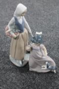 Two Nao figures : child with puppy and lady with goose