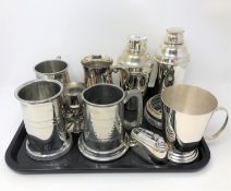 A tray of silver plated wares including cocktail shakers, table lighter,