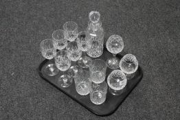 A tray of crystal glasses and decanter