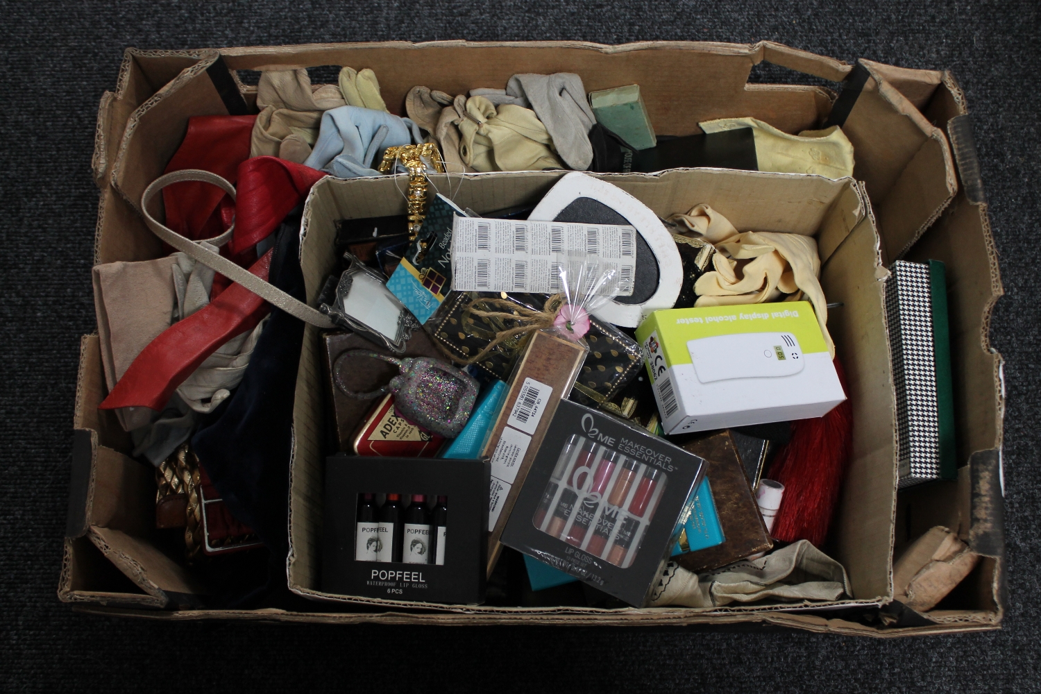 A box of vintage lady's gloves, perfumes,