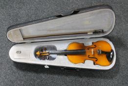 A violin with delux case and bow labelled within Lark