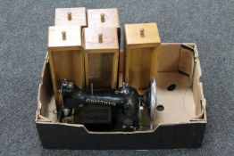 A continental sewing machine with oak drawers