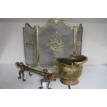 An antique brass embossed coal bucket, set of fire dogs,
