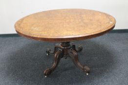 A Victorian carved walnut oval breakfast table