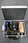 A Nikon D700 camera, in aluminum case with Soligor f=300mm lens, Nikon Prinz Galaxy f=135mm lens,