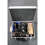 A Nikon D700 camera, in aluminum case with Soligor f=300mm lens, Nikon Prinz Galaxy f=135mm lens,