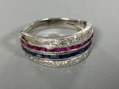 An 18ct ruby sapphire and diamond eternity ring,