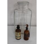 Two antique brown glass chemist's jars and a vintage Easipat lidded jar