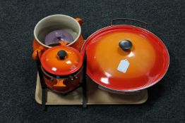 A Le Creuset twin handled cast iron wok with lid, fondue pot on stand,