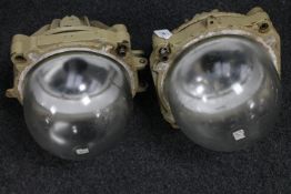 A pair of industrial bulk head lights