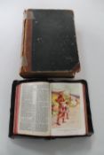 An antique Holy bible and a leather bound German dictionary