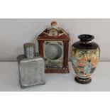 An oriental pottery mantel clock case with character marks to base,