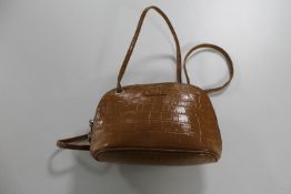 A tan leather Osprey of London clutch bag