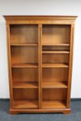 A reproduction yew wood bookcase