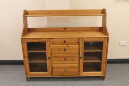 A pine sideboard fitted with four drawers