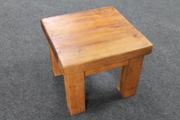 A contemporary pine lamp table