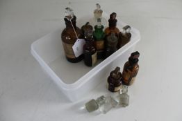 A box of ten miniature antique chemist's bottle and three glass stoppers