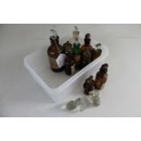 A box of ten miniature antique chemist's bottle and three glass stoppers