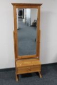 A pine cheval mirror fitted a drawer