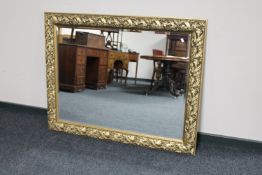 An ornate gilt framed bevelled mirror