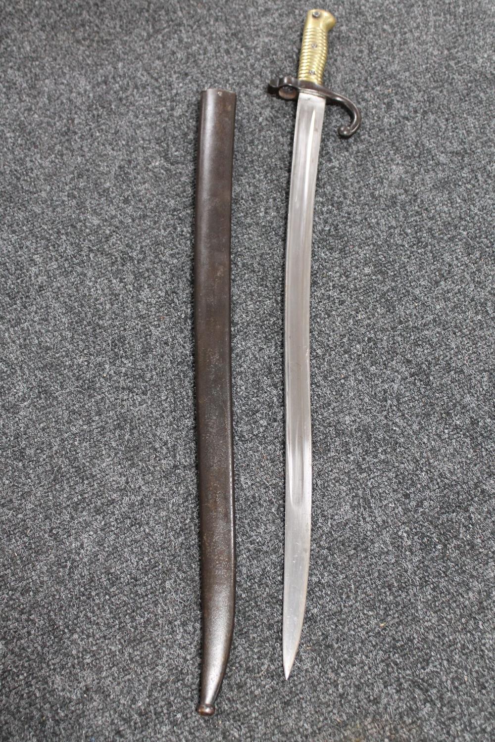 A 19th century French Chassepot bayonet in scabbard