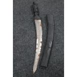 An African sword in leather scabbard