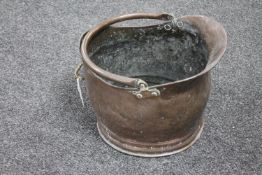 A Victorian copper coal helmet