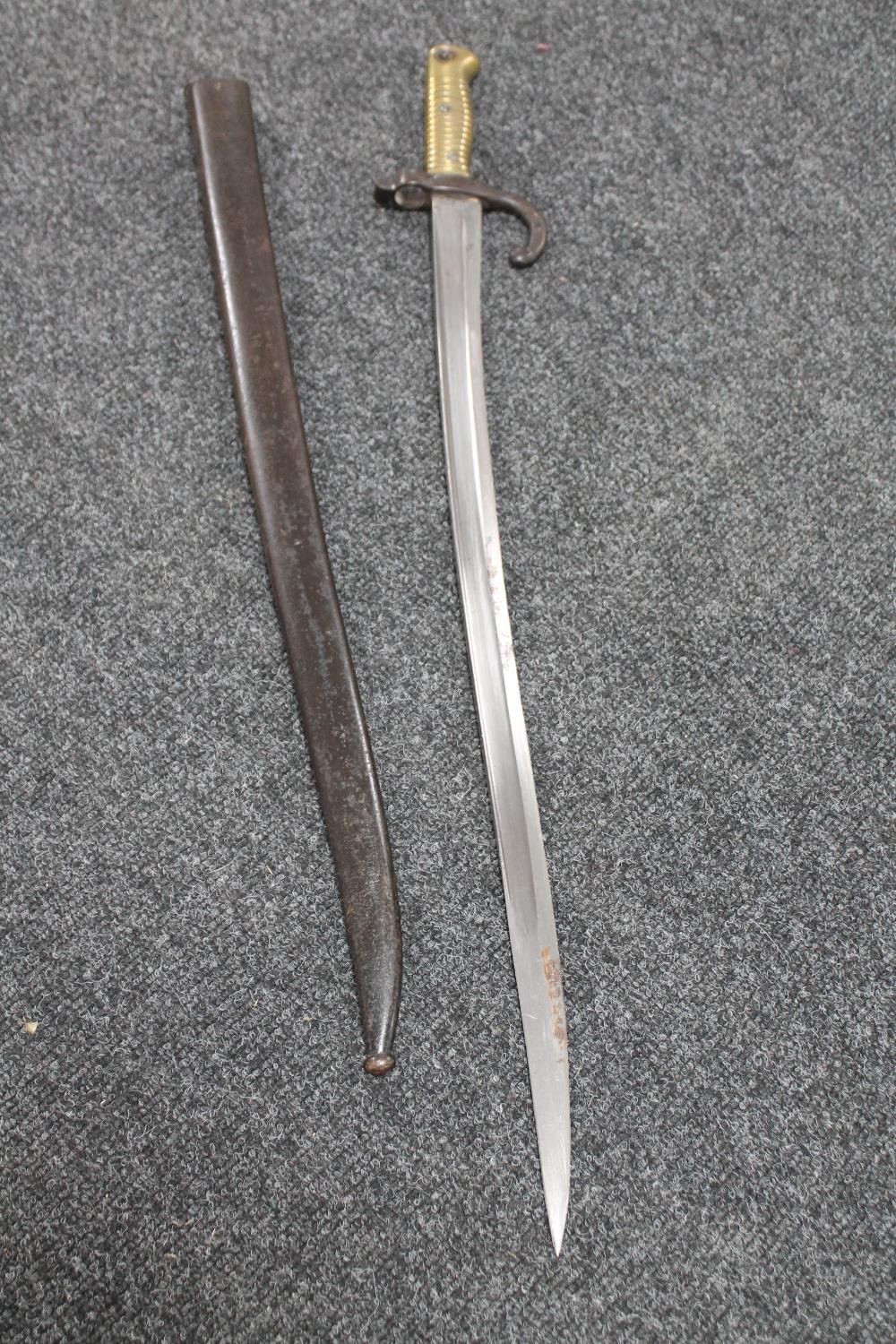 A 19th century French Chassepot bayonet in scabbard