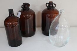 Two brown glass demijohns,