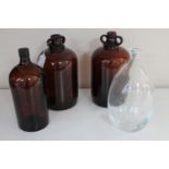 Two brown glass demijohns,