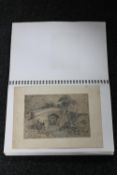 A folio of antique black and white photographs,