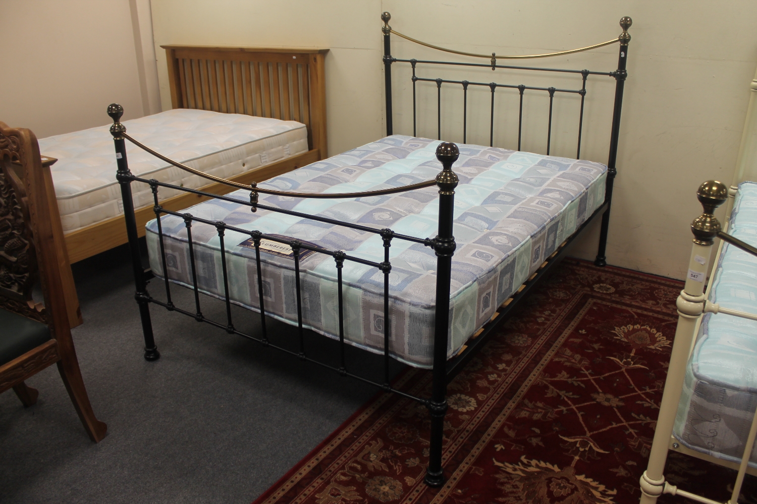 A Victorian style 4'6 brass and metal bed frame with Slumberest mattress