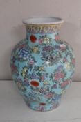 A 20th century Chinese pottery vase, decorated with flowers,