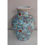 A 20th century Chinese pottery vase, decorated with flowers,