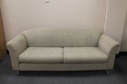 A late twentieth century settee upholstered in a beige fabric