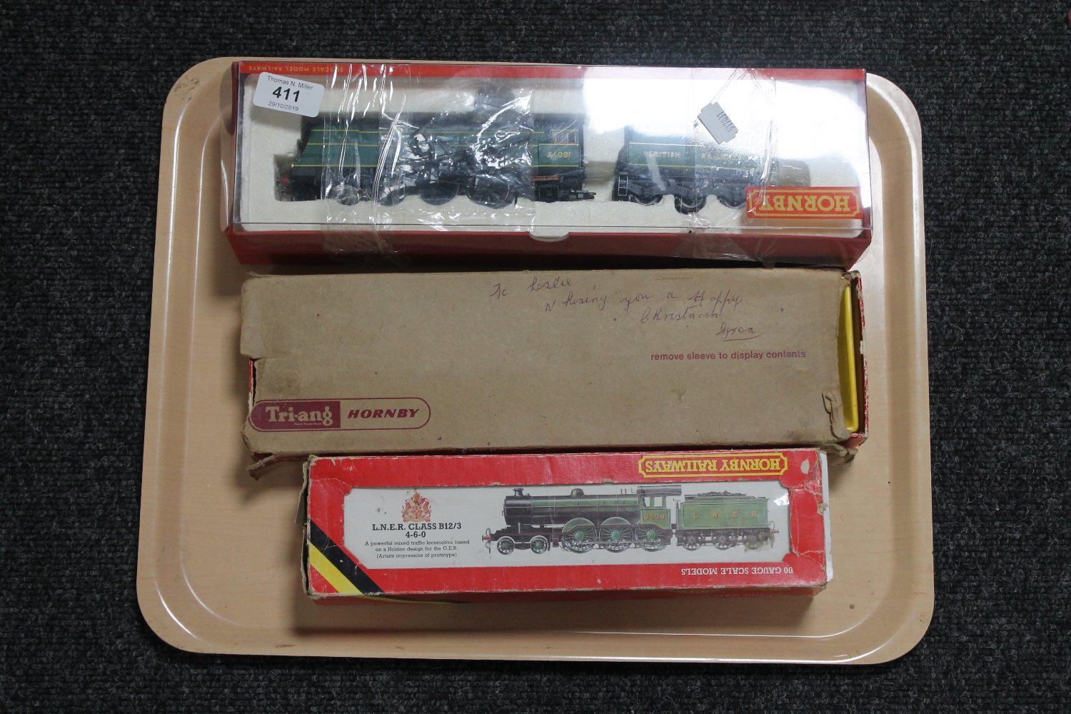 Three Hornby locomotive engines in boxes