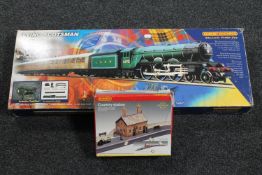 A boxed Hornby Railways Flying Scotsman electric train set and a boxed Hornby country station